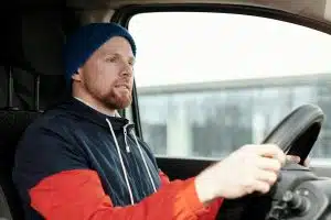 Commercial fleet driver operating a vehicle safely, reflecting a safety-first culture in fleet management.