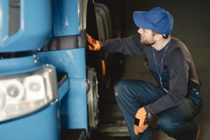 Technician performing vehicle inspection