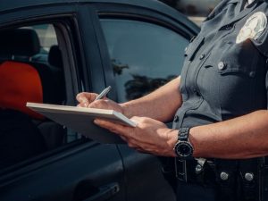 Police officer filing an official accident report.